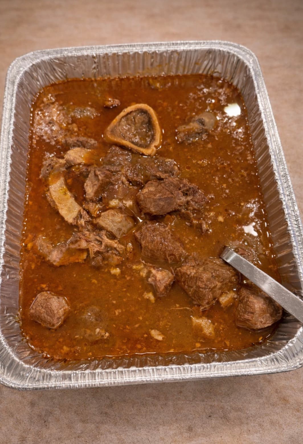 Beef Nihari — slow-simmered stew ready for a catering tray